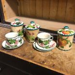 A collection of Wemyss ware including three jam pots decorated with redcurrents, raspberries and