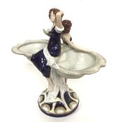 A Royal Dux porcelain table centrepiece with Two Maidens with shell shaped dishes to side, decorated