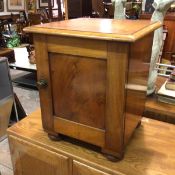 A Victorian mahogany cabinet, the square top with moulded edge above a panel door, raised on bun