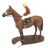 A Beswick china figure, Red Rum, winner of the Aintree Grand National 1973, 1974 and 1977,