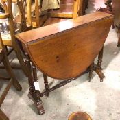 A Victorian mahogany oval drop leaf gateleg Sutherland tea table with moulded edge, on twin end
