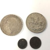 Two George V silver crowns, 1935, a silver threepenny bit and a Victorian farthing, 1851 (4)