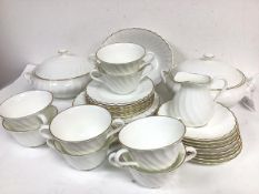 A Wedgwood gold Chelsea spiral lobed and gilt bordered thirty four piece dinner service including