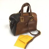 A Fendi miniature handbag with black, brown and tan leather, with gold tonal hardware, complete with