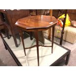 An Edwardian octagonal occasional table with inlaid border, on square tapered supports united by