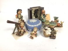 A collection of Hummel and Hummel style pottery figures including Star Gazer, Girl Sweeping,