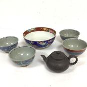 A set of four Japanese rice bowls decorated with stylised pomegranate design, a Japanese pottery