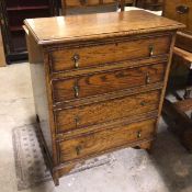 A 1920s oak chest, the rectangular top above four graduated long drawers, with beaded borders, on