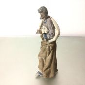 A Spanish Lladro porcelain figure, Saint Praying, decorated with polychrome enamels (35cm x 16cm x