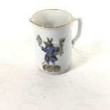 A late 19thc German porcelain jug decorated with Trusty Servant transfer printed enamelled figure (