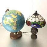 A 1970s teak based terrestrial globe and a bronzed style metal Tiffany style lamp (globe: 41cm.