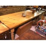 A country house style pine rectangular kitchen table, the top with moulded edge and rounded angles