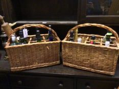 Two wicker spirit baskets complete with various spirits etc. (39cm x 43cm x 23cm), a walking stick