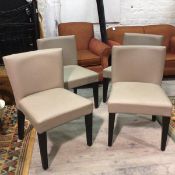 A set of four Orior Italian leather covered grey leather upholstered panel back and seat side