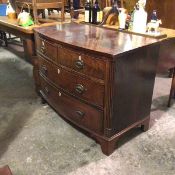 A 19thc mahogany bow front chest, fitted two short and two long drawers, with oval plaque handles