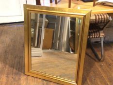 A rectangular gilt framed composition mirror (88cm x 72cm)