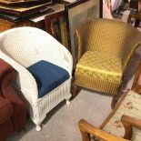 A white painted 1920s Lloyd Loom style basket chair with inset seat, on pad feet and a gold