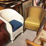 A white painted 1920s Lloyd Loom style basket chair with inset seat, on pad feet and a gold