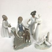 A Lladro Spanish porcelain figure group, Girl with a Calf, a Nao style Girl with Candle, a Nao