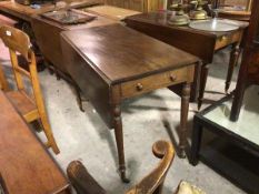 A 19thc mahogany pembroke table, the rectangular top with rounded angles fitted single end drawer,
