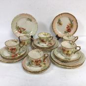 A Nautilus porcelain twenty two piece tea service decorated with traditional red and yellow poppy