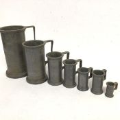 A group of seven Continental pewter measures (tallest: 19cm)