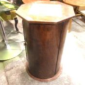 A mahogany cylinder pedestal bedside with associated octagonal top, on plinth base (63cm x 41cm)