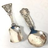 A Norwegian white metal pierced caddy spoon with chased landscape decoration and lattice pierced
