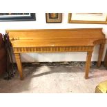 A modern custom made yew wood console table of eliptical sided form with fluted frieze and ledge