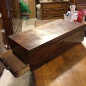 A 19thc mahogany box desk, the hinged top enclosing an unfitted interior, with slide out drawer to