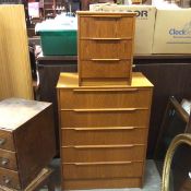 A 1960s/70s teak two piece bedroom suite comprising a three drawer veneered bedside and matching
