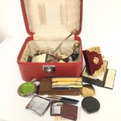 A vanity case containing The Common Prayer book, two silver propelling pencils, a Ronson lighter,