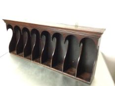 A George III mahogany estate wall file rack fitted eight arched sections, with shaped sides (one