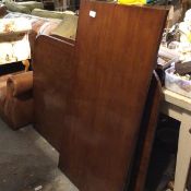 A reproduction mahogany twin pedestal extending dining table, with fluted edge on tripod supports