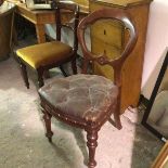 A Victorian mahogany desk style chair, with arched back and deep leather buttoned hide seat, on