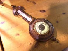 An Edwardian walnut aneroid wall barometer complete with thermometer, with enamelled dial (56cm x
