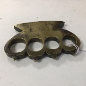 A set of WWI trench brass knuckle dusters with pyramid spiked knuckles (10cm x 6.5cm x 8cm)