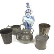 A pewter Arts & Crafts style beaker with three leaf clover design, a two handled sugar basin with