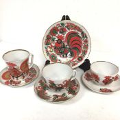 A group of three Lomonosov Russian porcelain cups and saucers, complete with plate (19cm)