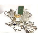 An Epns four piece condiment set, complete with crystal liners, a crystal Epns mounted sugar castor,
