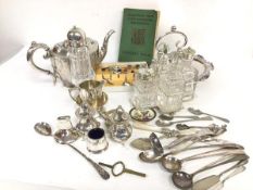 An Epns four piece condiment set, complete with crystal liners, a crystal Epns mounted sugar castor,