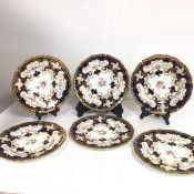A set of six Royal Crown Derby porcelain plates with scalloped borders, decorated with handpainted