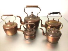 A 19thc collection of five various copper teapots, two with acorn finials, two with knop finials,