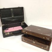 A Victorian rosewood mother of pearl inlaid writing box, the top enclosing a fitted interior with