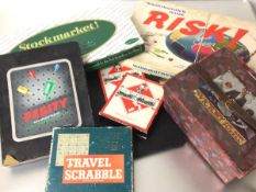 A collection of vintage games including Peggity, Monopoly, Risk, Stock Market and a Victory jigsaw