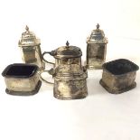 A Birmingham silver octagonal six piece condiment set including two salts with glass liners, two