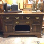 An Edwardian sideboard base, the rectangular top with moulded edge above two frieze drawers above