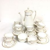 A Royal Worcester Gold Chantilly pattern coffee set, of twenty six pieces, with gilt borders (coffee