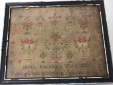 Sarah Blackburn, 1832, a framed and glazed linen sampler with stylised peacocks, flowers etc.,