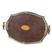 An Edwardian mahogany inlaid metal galleried two handled tea tray with inlaid centre satinwood panel
